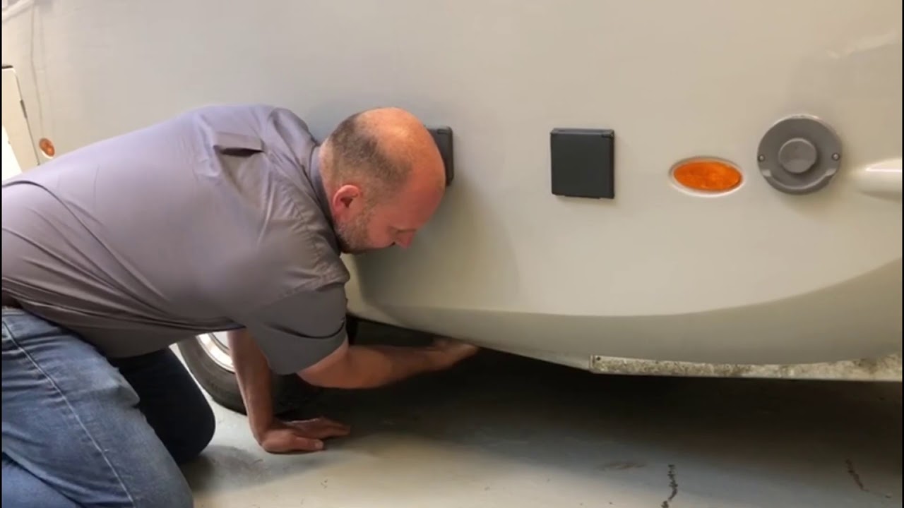 Checking the running gear before hitching a Barefoot Caravan